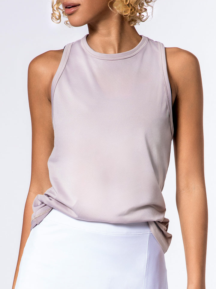 Model showcasing PB5star's women's Core Tank in soft clay, designed with breathable mesh fabric, ideal for stylish comfort during pickleball games and tournaments.