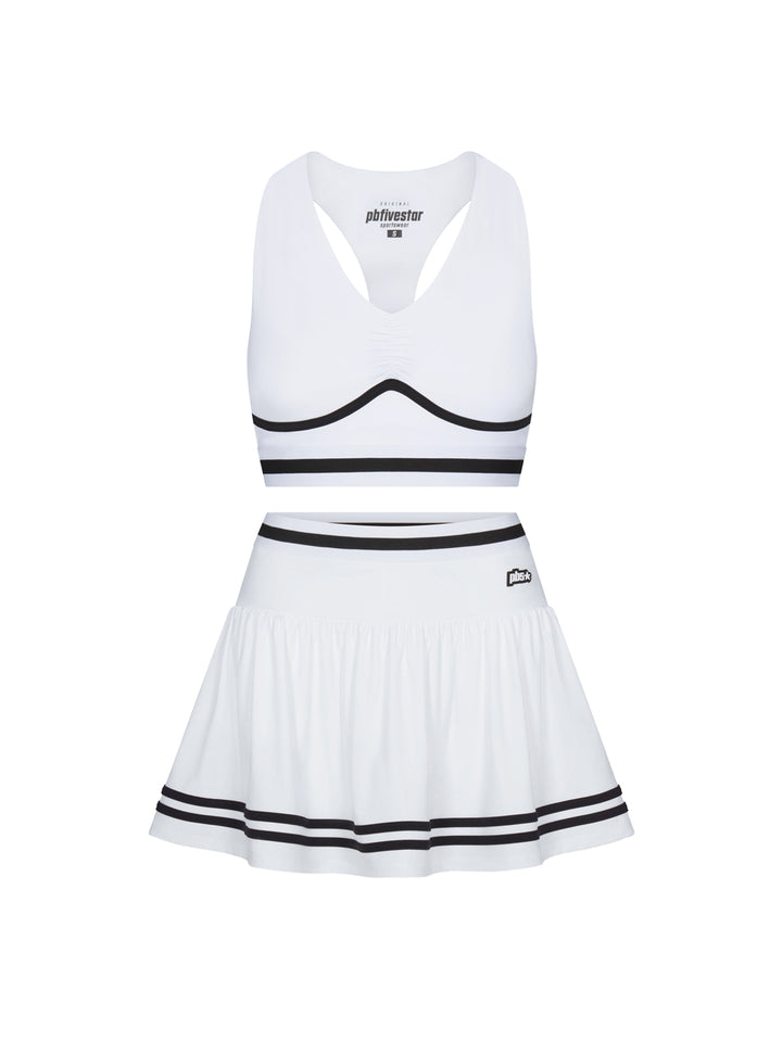 Heritage two-piece set in white with black trim, shown as bra top and skirt