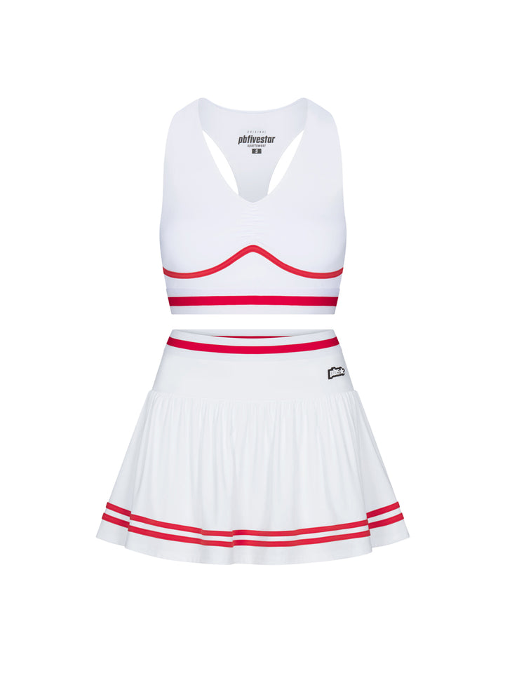 Heritage two-piece set in white with cherry trim, shown as bra top and skirt