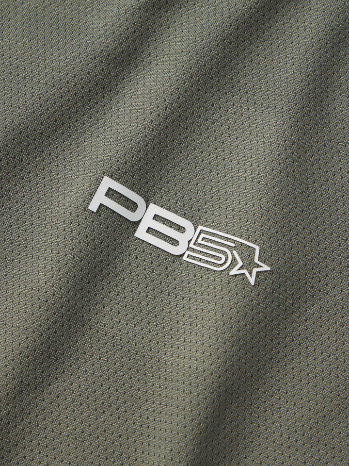 Zoomed-in view of the PB5star logo on the Core Performance Tee in pavement, showcasing the brand's focus on quality sportswear.