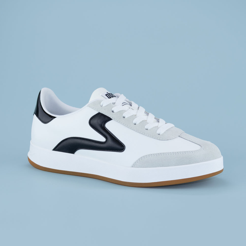 PB5STAR Cosmic sneaker in white with black detailing, grey suede toe, and gum sole, displayed in isometric view on a light blue background.