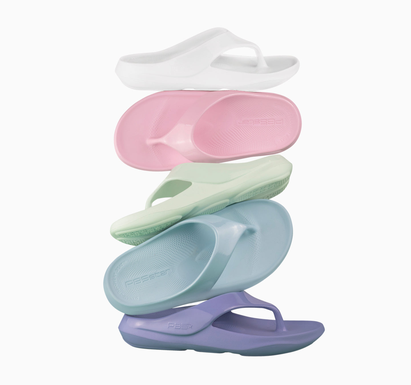 Stack of PB5star recovery flip flops in white, pink, mint, blue, and purple pastel colors on white background
