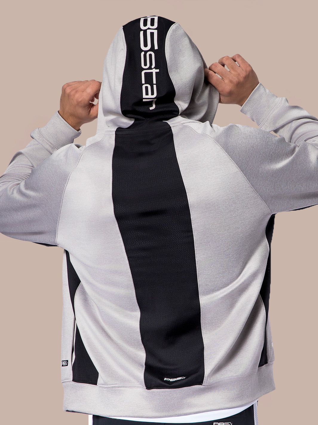Rear view of a PB5star grey heather Performance Full Zip Hoodie with the brand name on the hood, against a neutral backdrop.