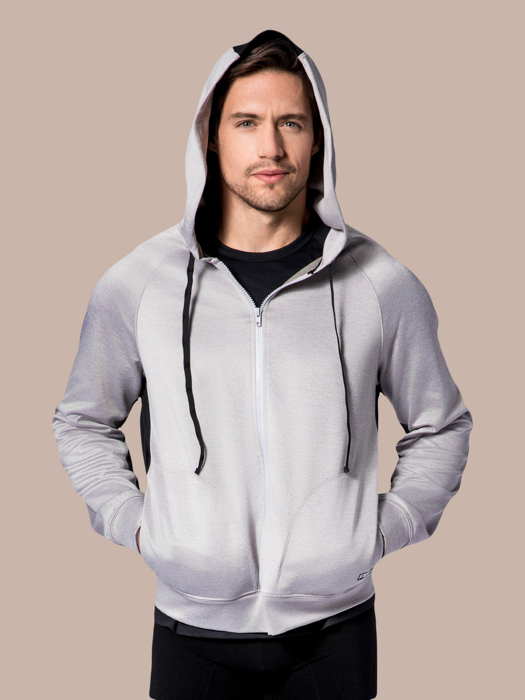 Model wearing a PB5star Performance Full Zip Hoodie in grey heather with hood up and black zipper.
