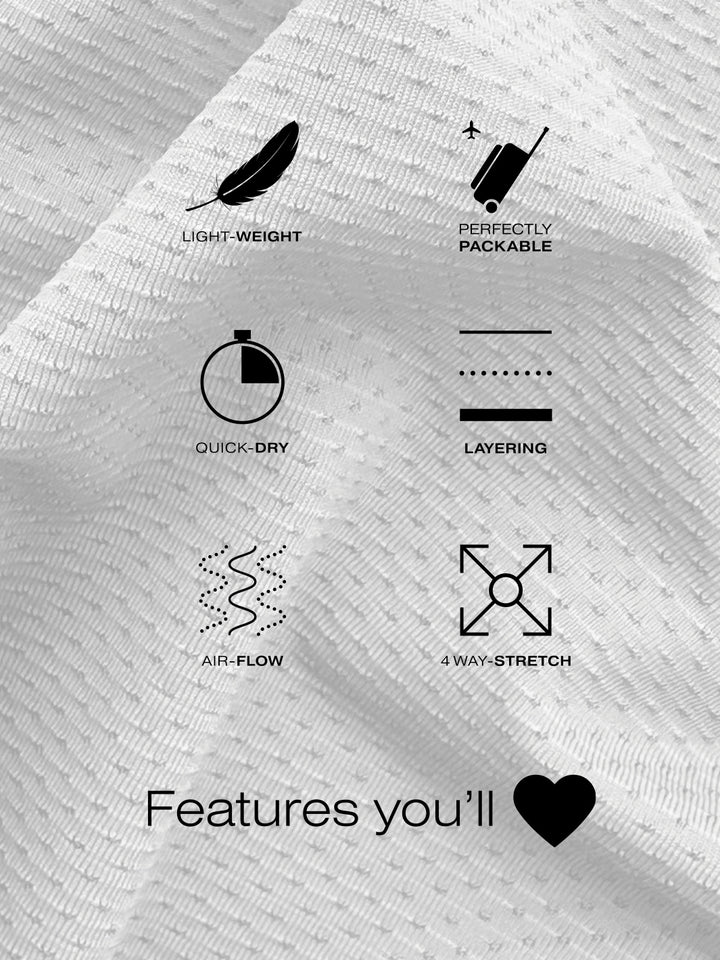 Close-up of white M's Long Sleeve Layering Tee fabric with icons showcasing features: lightweight, perfectly packable, quick-dry, layering, air-flow, and 4-way stretch.