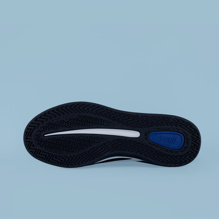 Outsole view of PB5star black and white men’s Cosmic sneaker, showing tread pattern and cushioned sneaker grip.