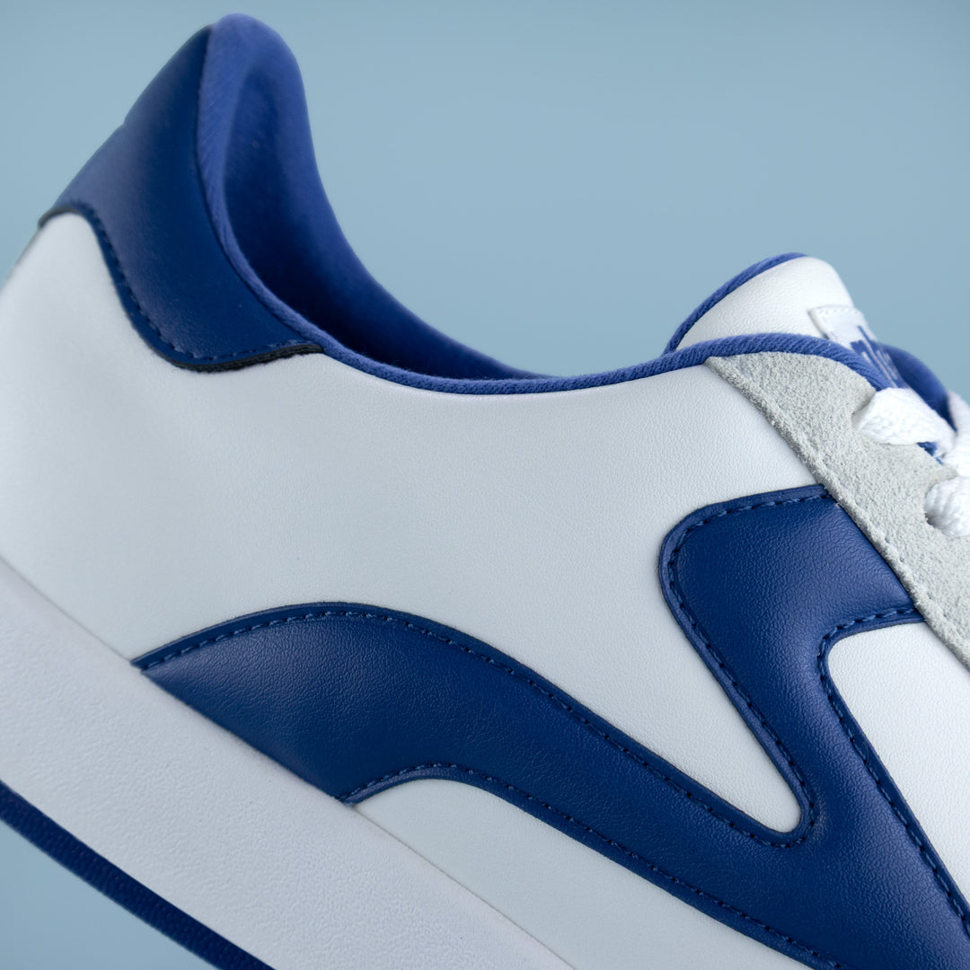 Side panel detail of PB5star men’s Cosmic sneaker  in white and blue — premium athletic footwear close-up
