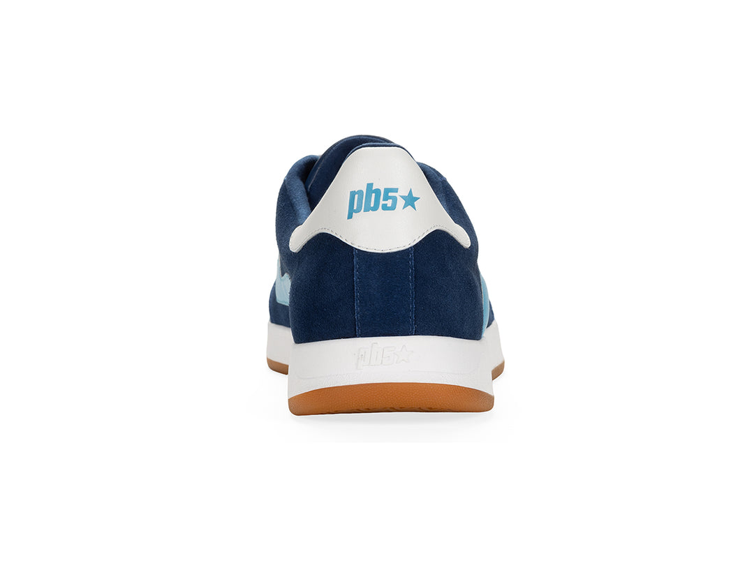 Rear view of a navy and sky low-top sneaker with gum sole