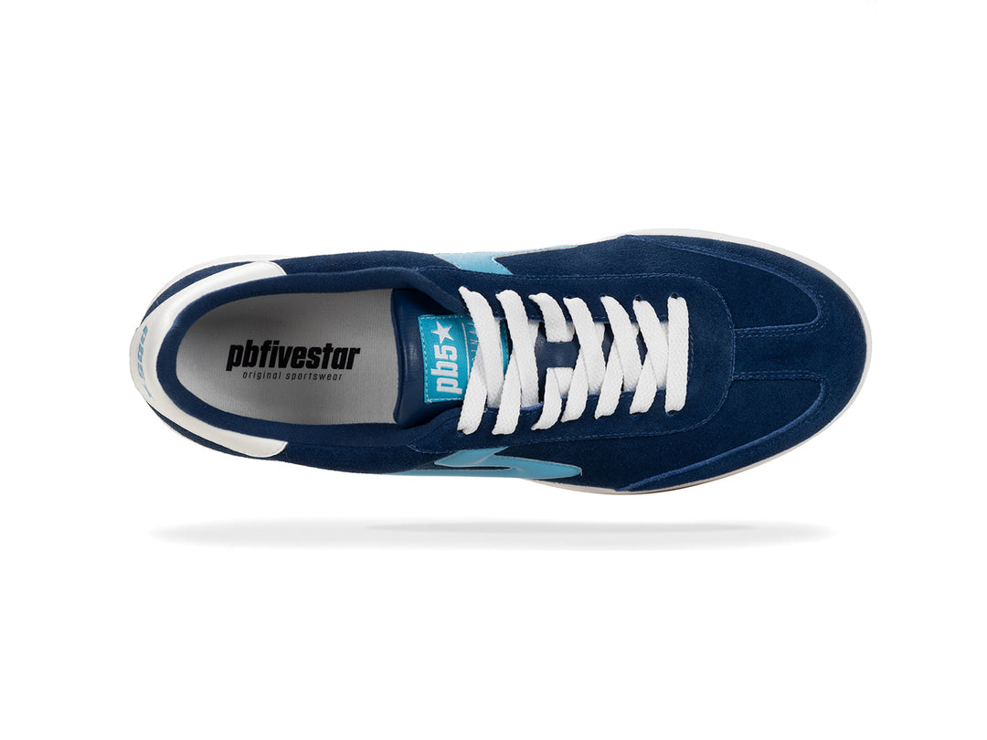 Top view of a navy and sky blue low-top sneaker with white laces
