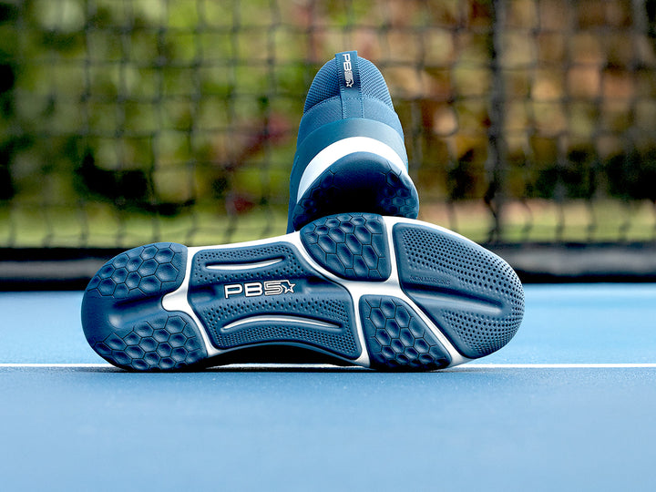 Close-up of the PB5 Court2 outsole in Astral Blue showcasing a non-marking sole with multi-zoned traction for superior grip on court surfaces.