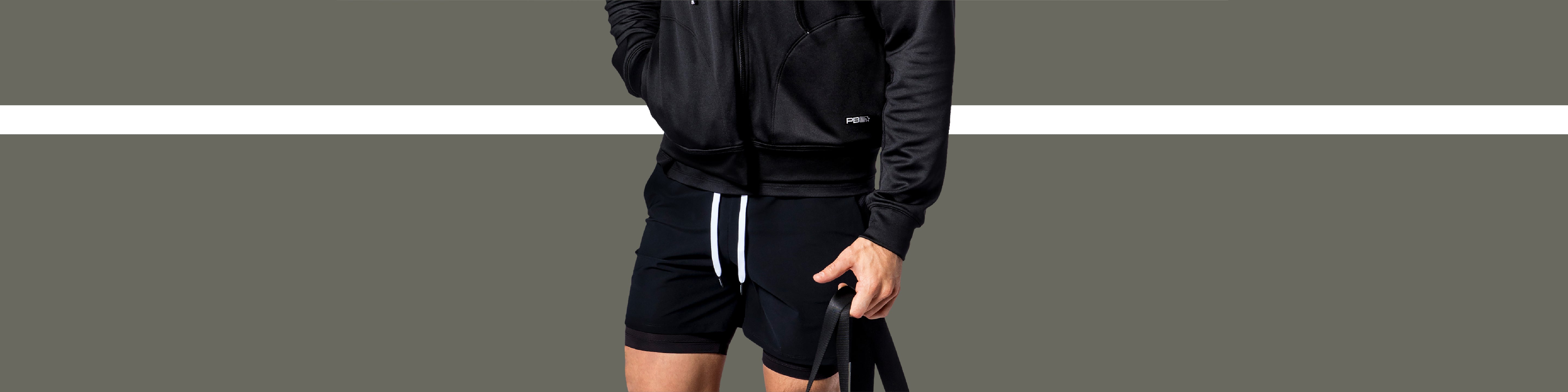 Close-up on model wearing men's Signature Court Shorts in black.