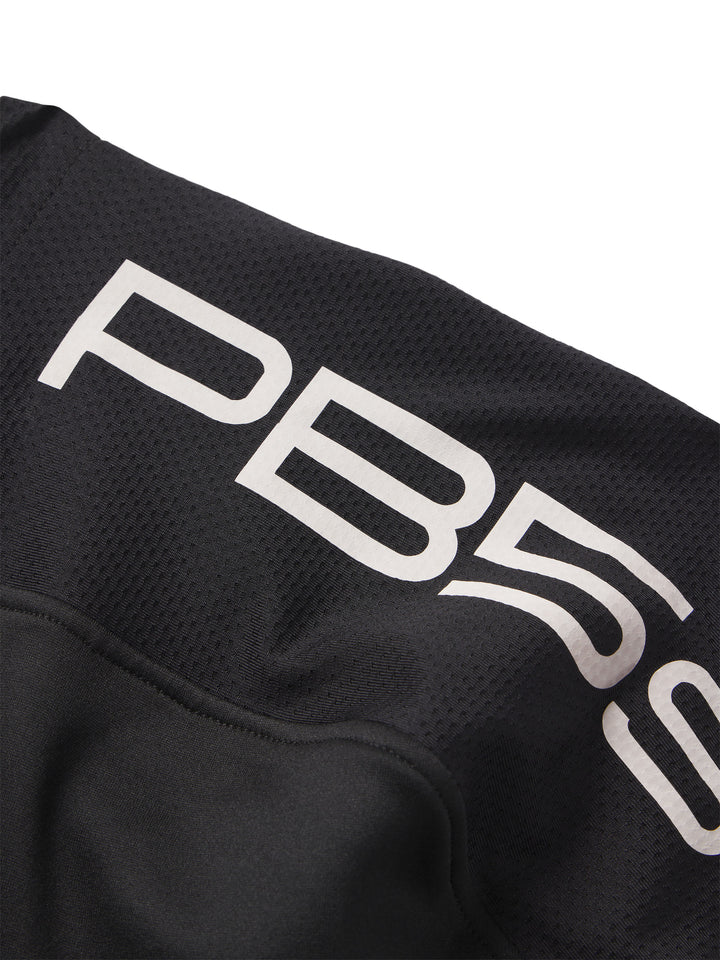 Detailed view of the PB5star branding on the hood of a black Performance Full Zip Hoodie, showcasing the contrast lettering and texture.
