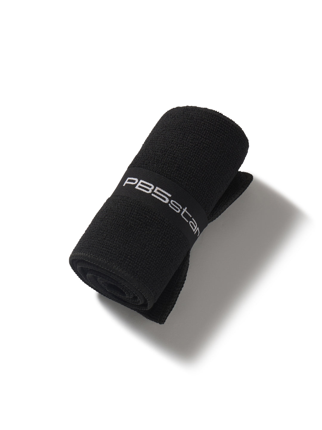 Rolled-up black towel with 'PB5star' branding on a white background