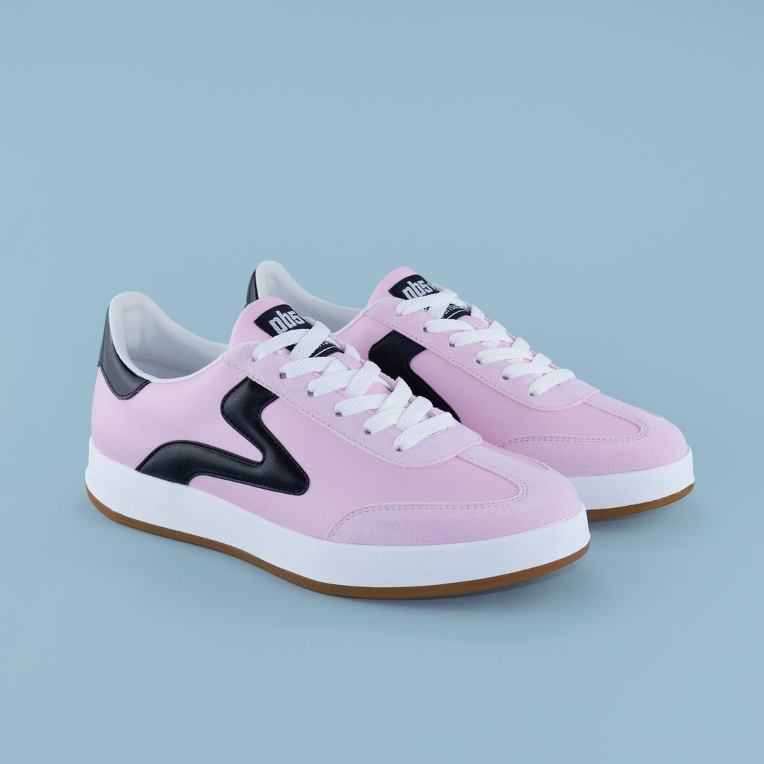 Pair of women’s Cosmic sneakers in pink and black with white laces, ideal pickleball shoes for athletic wear and court apparel.