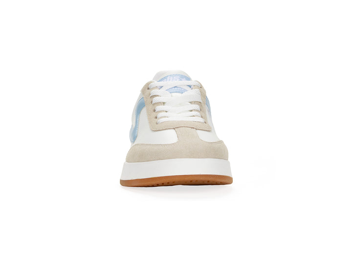 Front view of a white and light blue low-top sneaker with gum sole