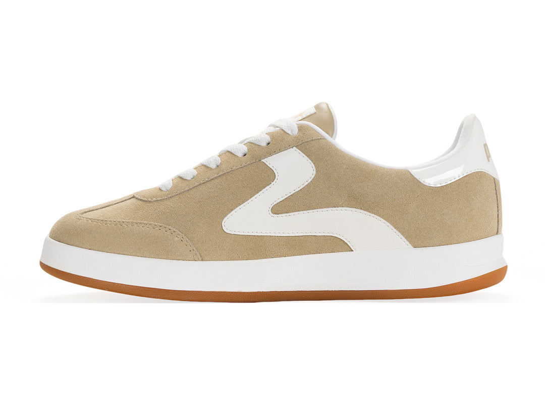 Medial side view of a sand and white low-top sneaker with gum sole and metallic gold heel tab