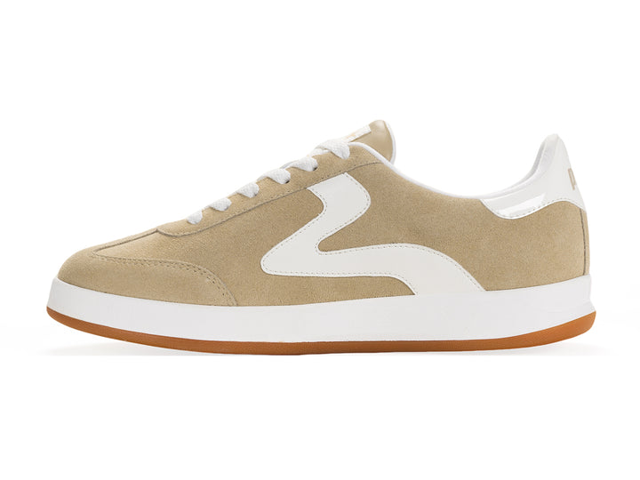 Medial side view of a sand and white low-top sneaker with gum sole and metallic gold heel tab