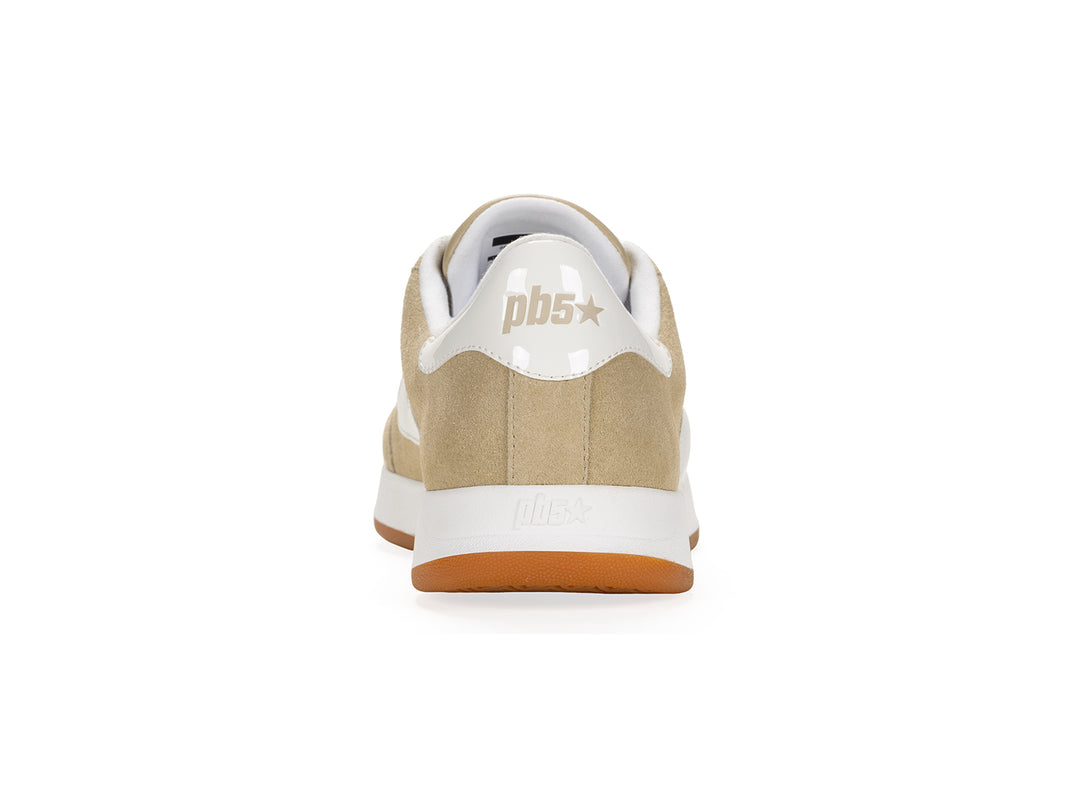 Rear view of a sand and white low-top sneaker with gum sole