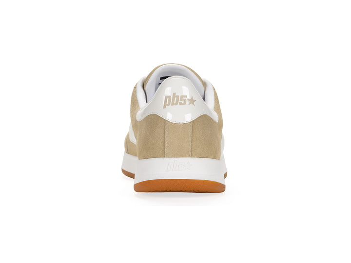 Rear view of a sand and white low-top sneaker with gum sole