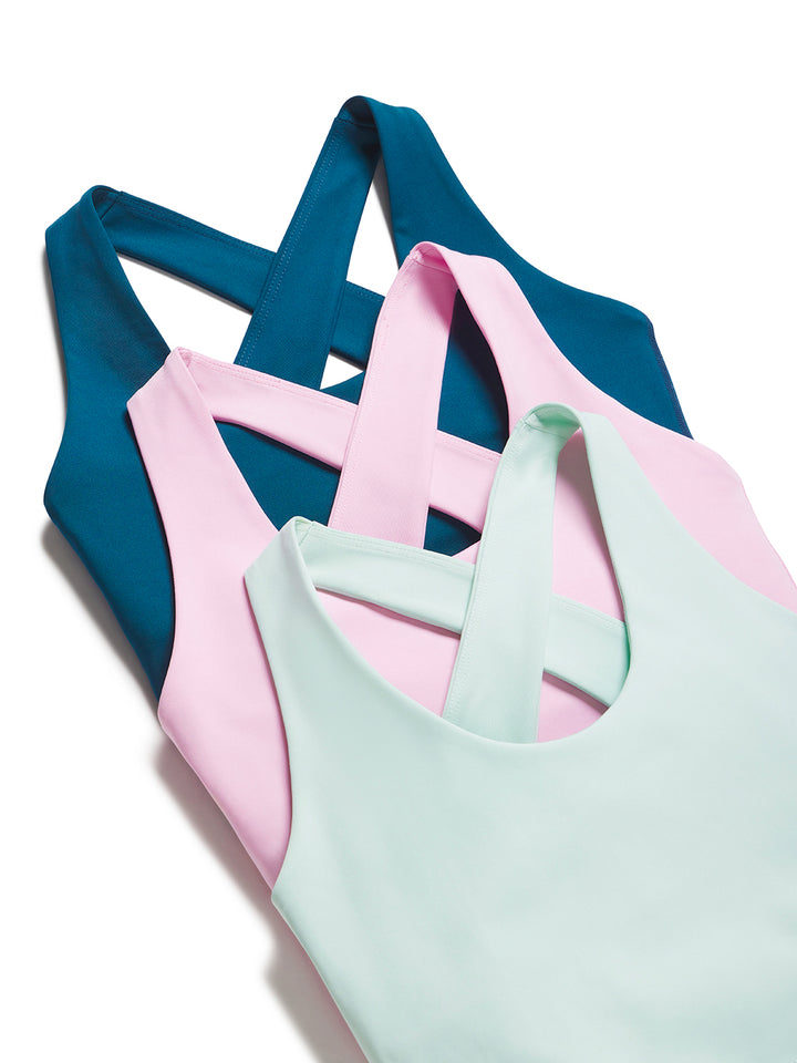 Stacked women's scoop neck bra tops in pastel colors including mint, powder pink, and astral blue by PB5star.