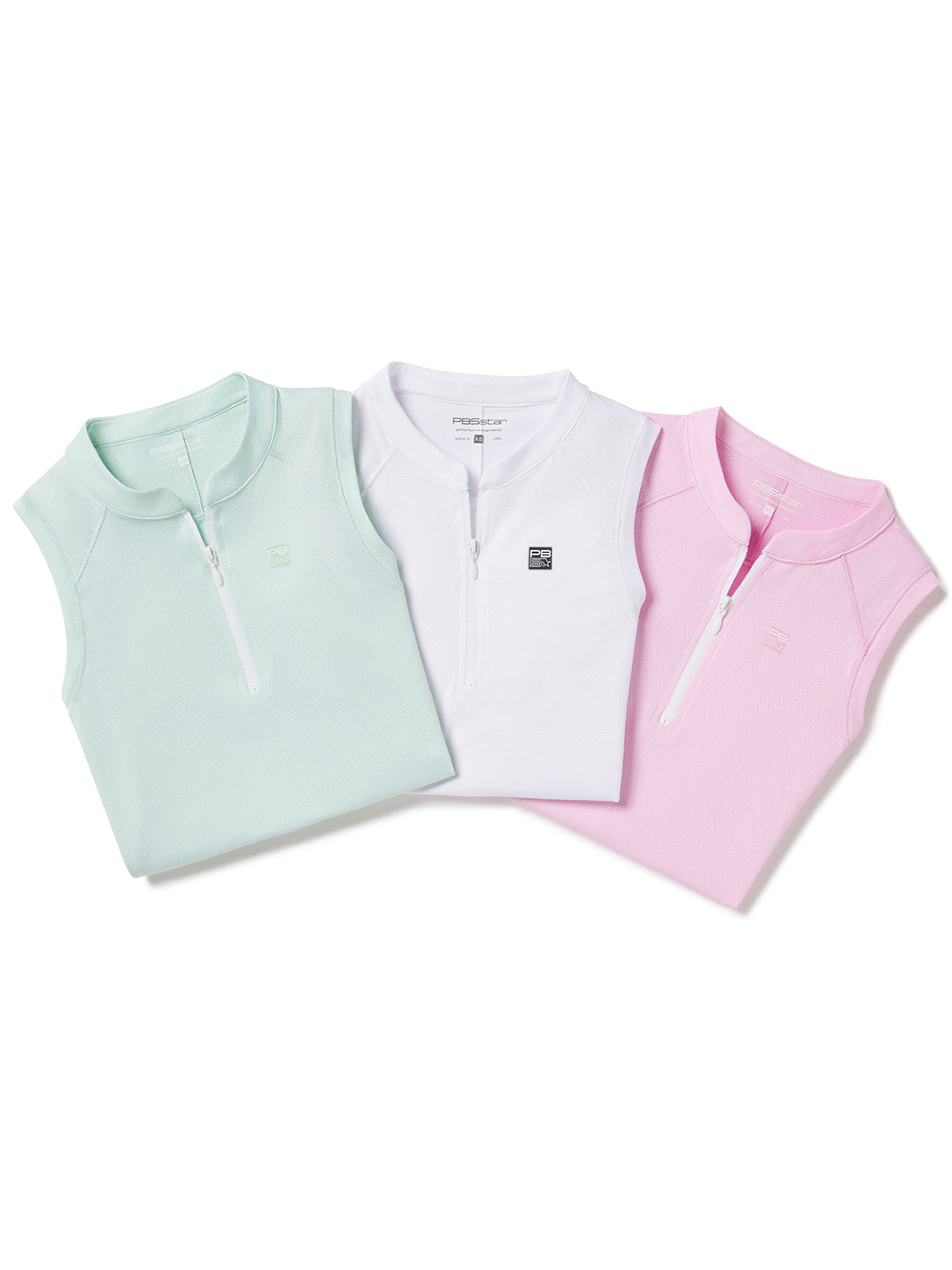 Group of women's zip tank tops in mint green, white, and pink colors neatly folded