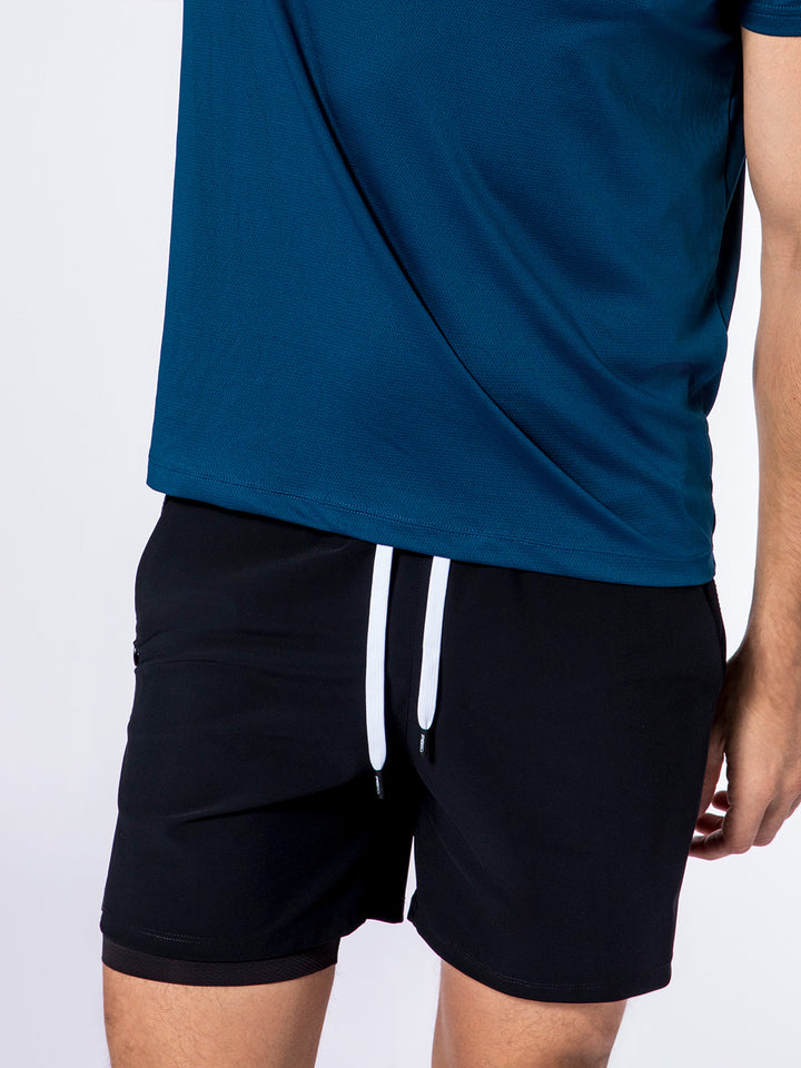 Close-up of PB5star black Signature Court Shorts with white drawstrings, designed for comfort and performance in sports.