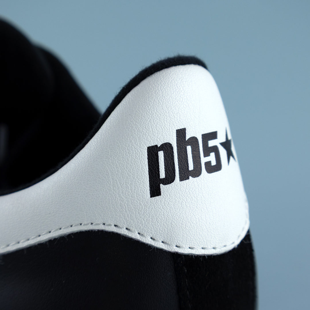 PB5star Cosmic pickleball shoe heel close-up in black and white, showing padded collar and PB5star logo