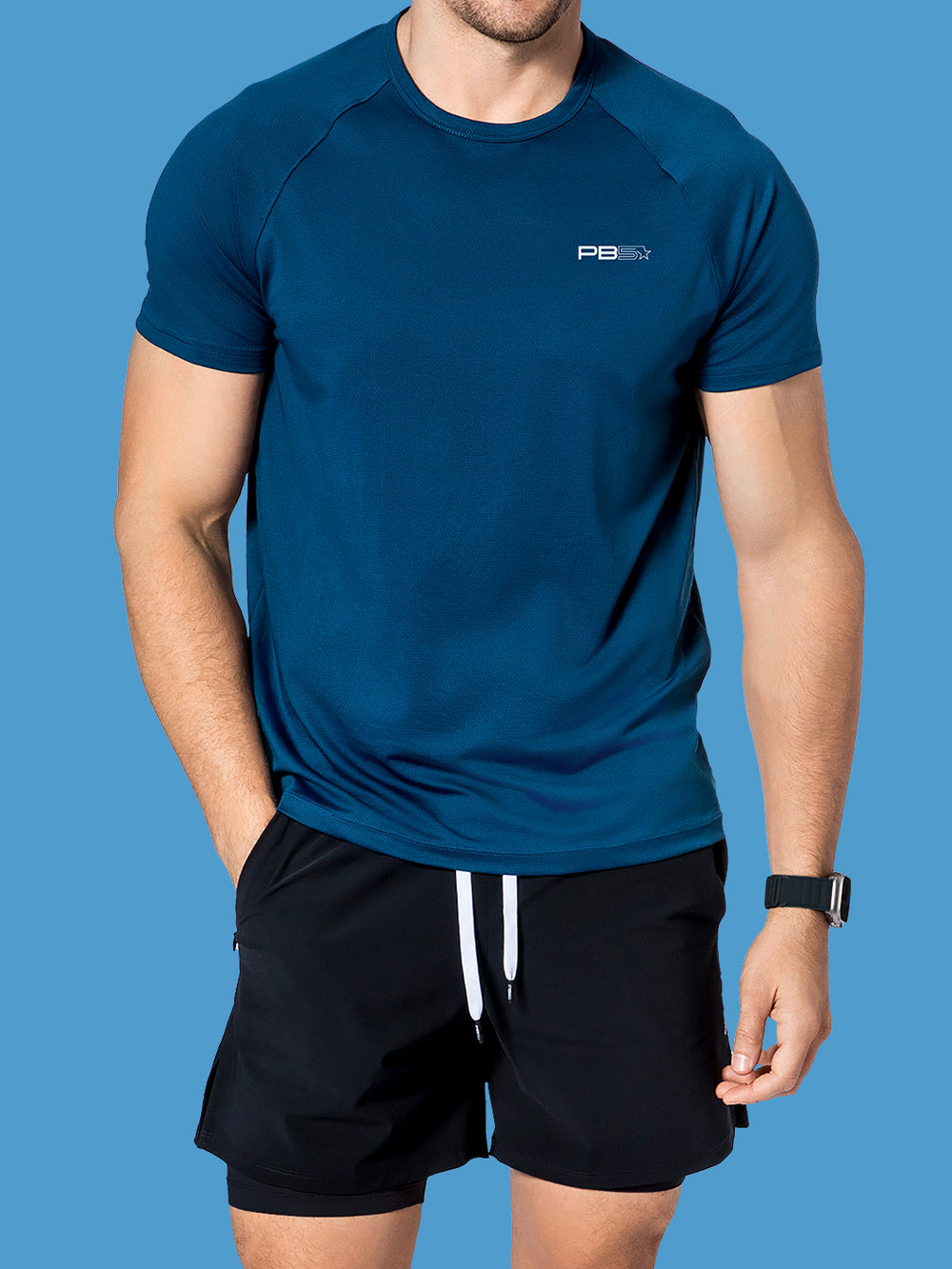 Model wearing a men's PB5star Core Performance Tee in astral blue, designed for optimal movement in pickleball.