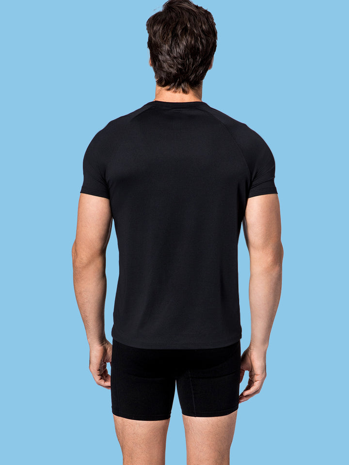 Rear view of a man in a PB5star Core Performance Tee in black, perfect for comfort during pickleball matches.