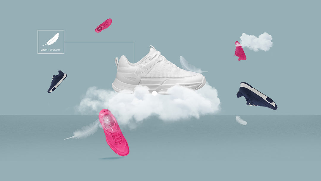 PB5star lightweight Court2 sneakers in white, black, and pink floating among clouds and feathers, emphasizing comfort and performance.
