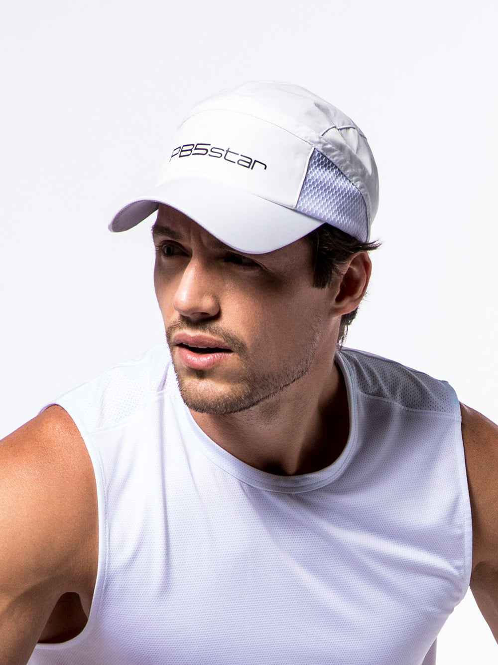 Athlete wearing a PB5star white signature cap with breathable mesh, ideal for active lifestyles and sports.