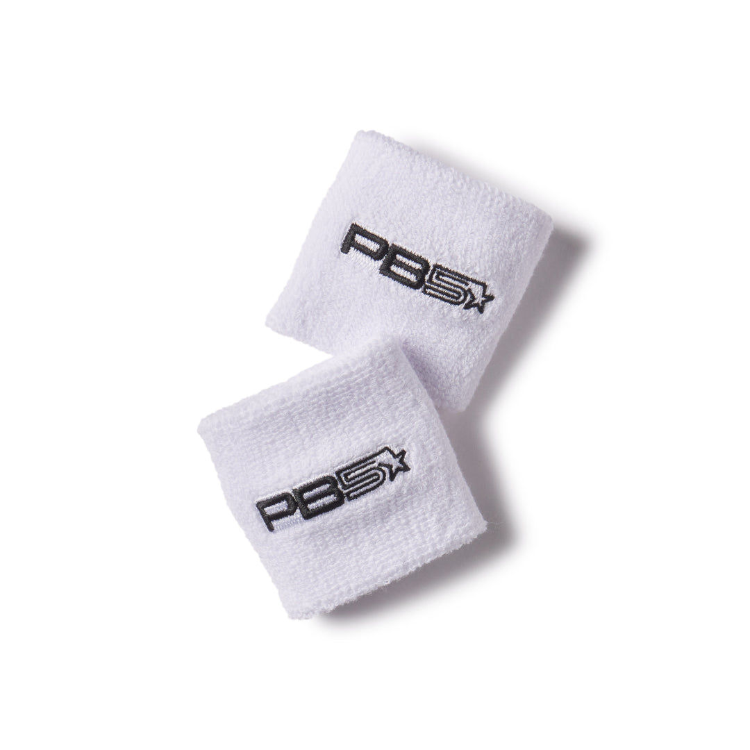 Pair of white PB5 Star performance wristbands with black embroidered logo, displayed on a white background. Soft and absorbent sports accessory. One-size fits all.