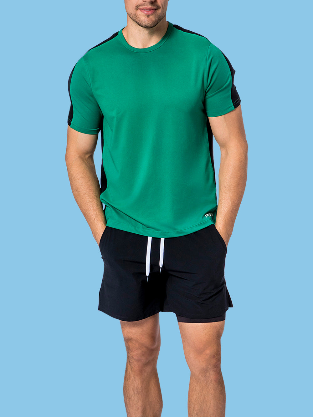 Model wearing PB5Star's jade men's Core Vented Tee with black side panels, ideal for sports and active lifestyle.