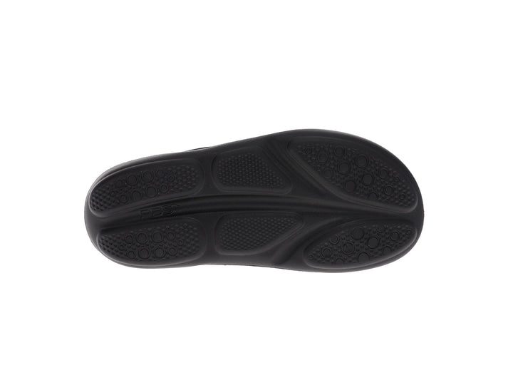 Bottom view of women’s Apres Sport Black slide sandal featuring textured comfort sole - PB5star.com