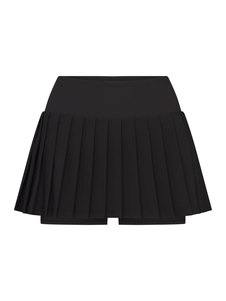 Front view of PB5star women's black pleated pickleball skirt with built-in shorts