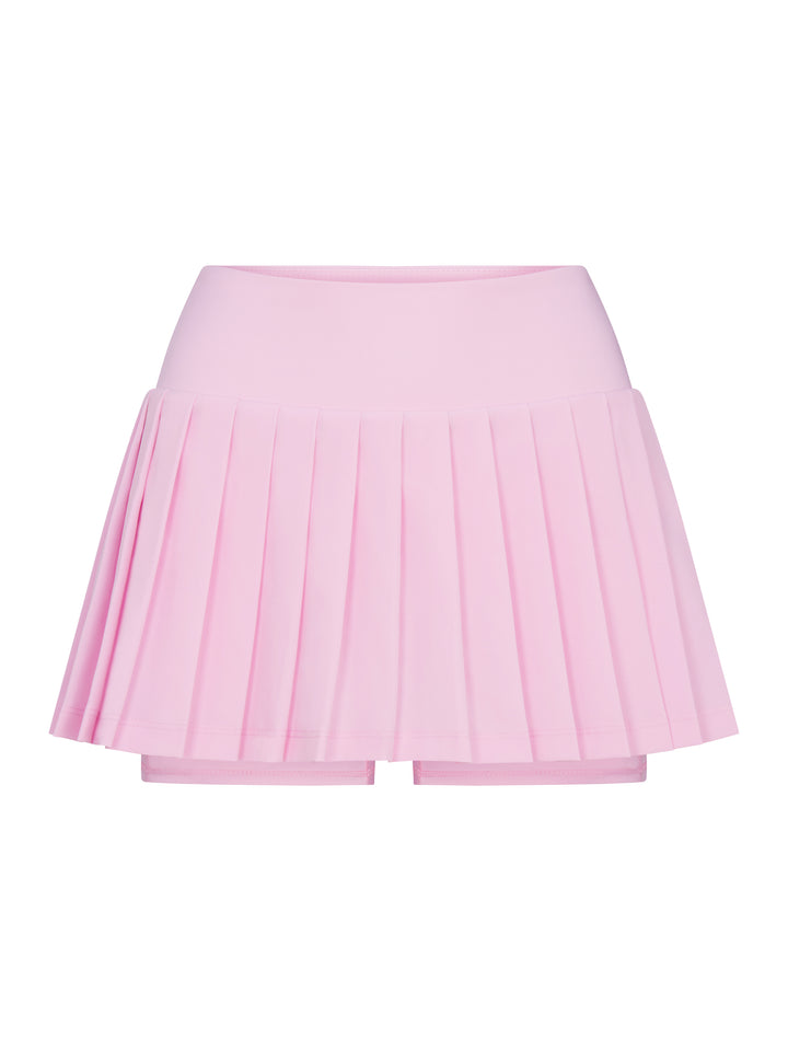 Front view of PB5star women's powder pink pleated tennis skirt with built-in shorts.